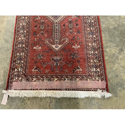 107 - A North West Persian red ground runner, 300 x 72cm