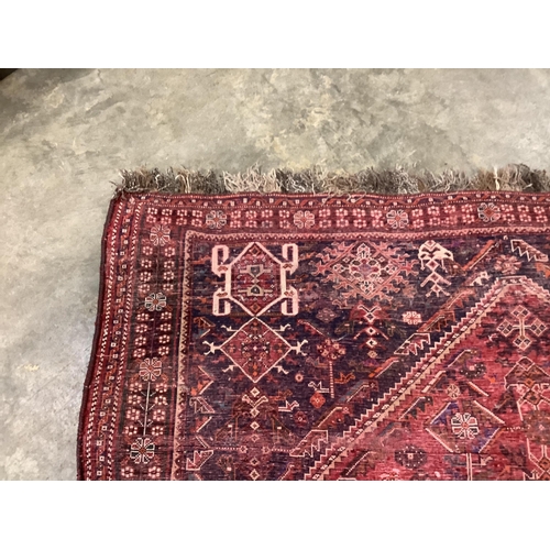 114 - A North West Persian red ground carpet, 264 x 165cm