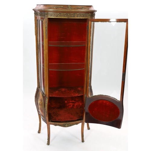 129 - A French Vernis Martin style walnut vitrine, of bombé form with ormolu mounts, three quarter glazed ... 