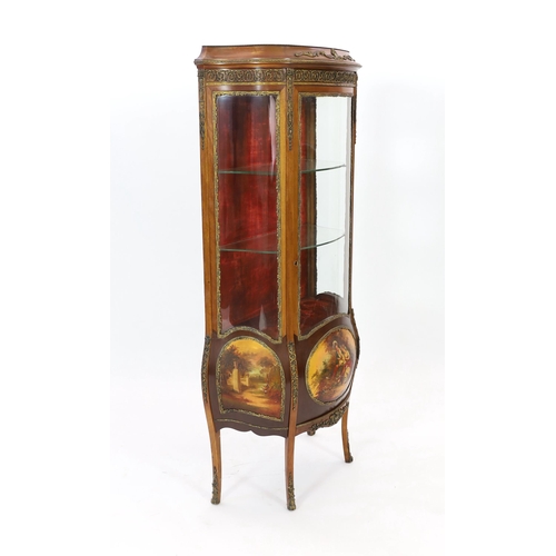 129 - A French Vernis Martin style walnut vitrine, of bombé form with ormolu mounts, three quarter glazed ... 