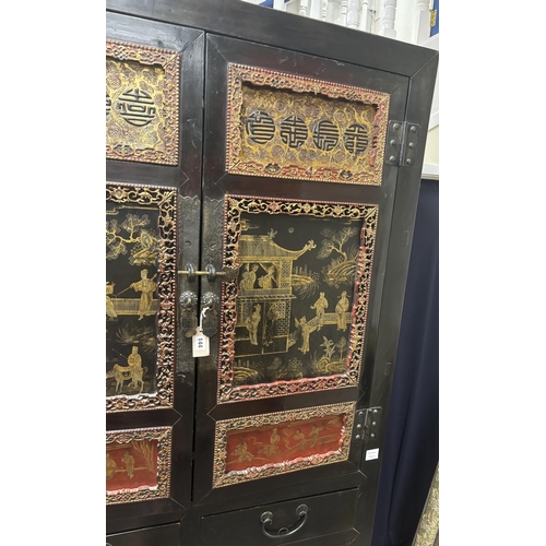 144 - A Chinese lacquered side cabinet, width 109cm, depth 50cm, height 203cm