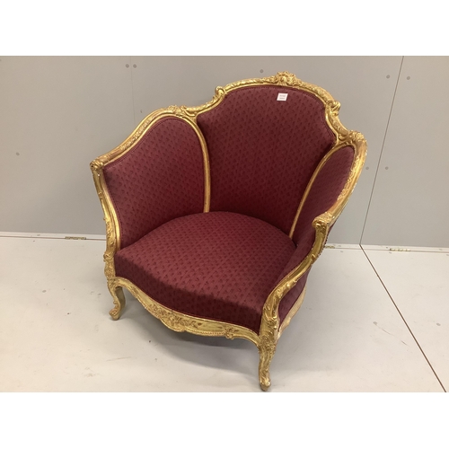 22 - A Louis XVI style carved giltwood tub framed salon chair, width 90cm, depth 70cm, height 90cm