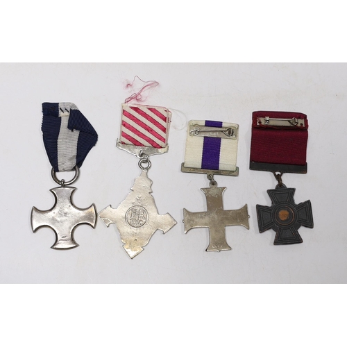 239 - Four well produced replica medals. A Victoria Cross, a Distinguished Service Cross, a Military Cross... 