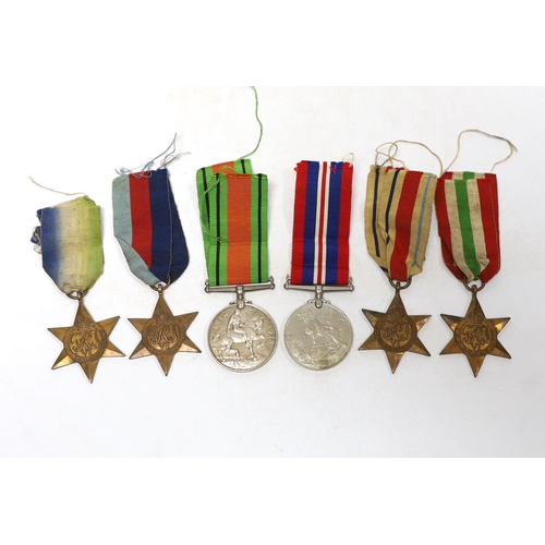 242 - Six WWII medals. The Atlantic Star, The Italy Star, The Africa Star, The 1939-45 Star, The Defence M... 