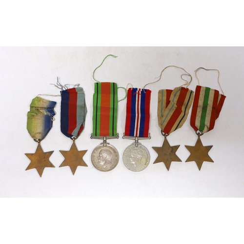 242 - Six WWII medals. The Atlantic Star, The Italy Star, The Africa Star, The 1939-45 Star, The Defence M... 