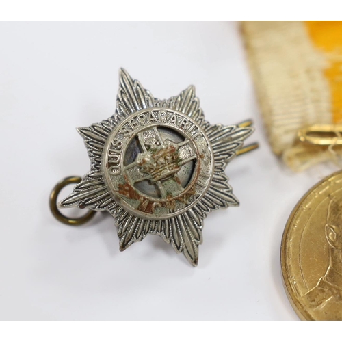 243 - A Russian commemorative House of Romanov medal and a regimental clasp, 1922