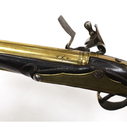 258 - A composite 20 bore brass barrel, flintlock holster pistol, fitted with brass mounts, long spur butt... 