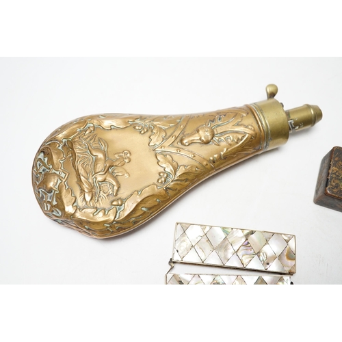 264 - A Victorian embossed brass powder flask, a leather shot flask and a Victorian mother of pearl and ab... 