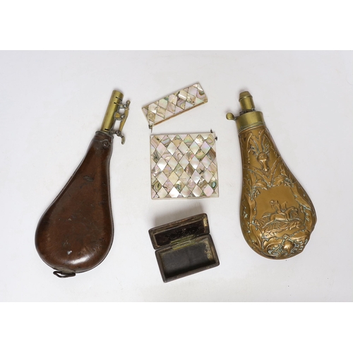 264 - A Victorian embossed brass powder flask, a leather shot flask and a Victorian mother of pearl and ab... 