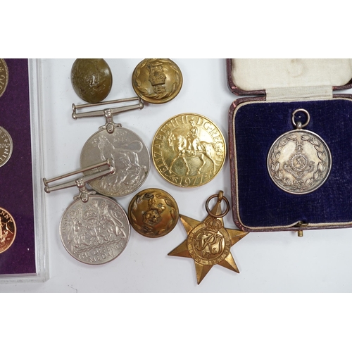 279 - A collection of medals and coins including; an original card Air Ministry box containing a 1939-45 s... 