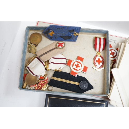 288 - A collection of British Red Cross, medals, badges and memorabilia including a brass plaque, commemor... 