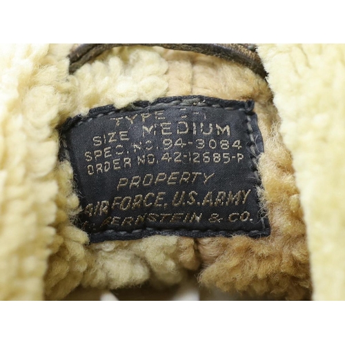 299 - An American US Air Force sheepskin flying jacket, with applied label in collar reading TYPE .. SIZ... 