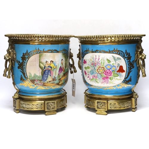 301 - A pair of brass mounted Kusnetzoff style jardinières hand painted with figures, 28cm high