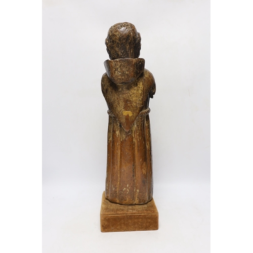 302 - An oak carved monk with polychrome face, 54cm high