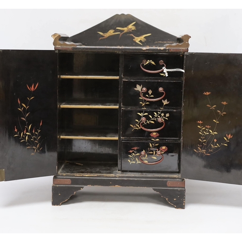 306 - A Japanese casket with fitted interior, lacquered with birds and flowers, 42cm high