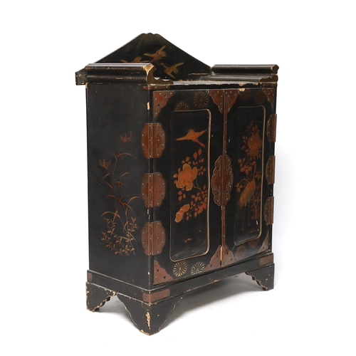 306 - A Japanese casket with fitted interior, lacquered with birds and flowers, 42cm high