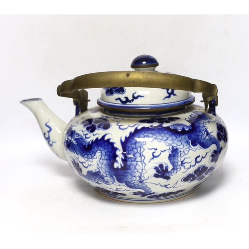 308 - A large Chinese blue and white dragon teapot, 38cm wide