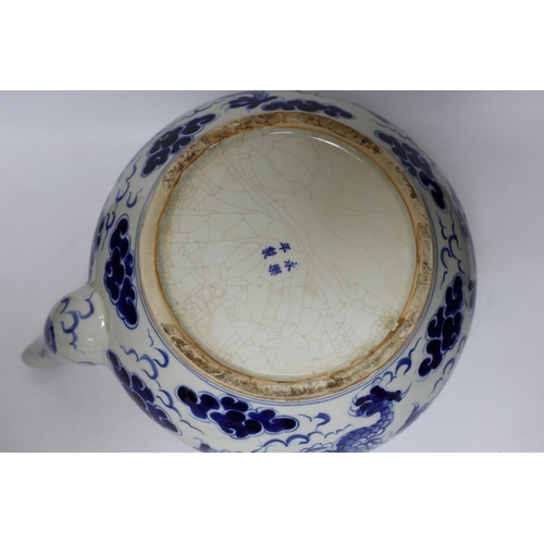 308 - A large Chinese blue and white dragon teapot, 38cm wide