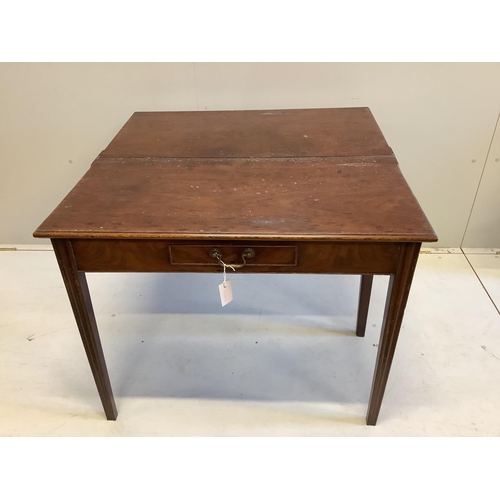 31 - A George III rectangular mahogany folding tea table, width 92cm, depth 45cm, height 73cm