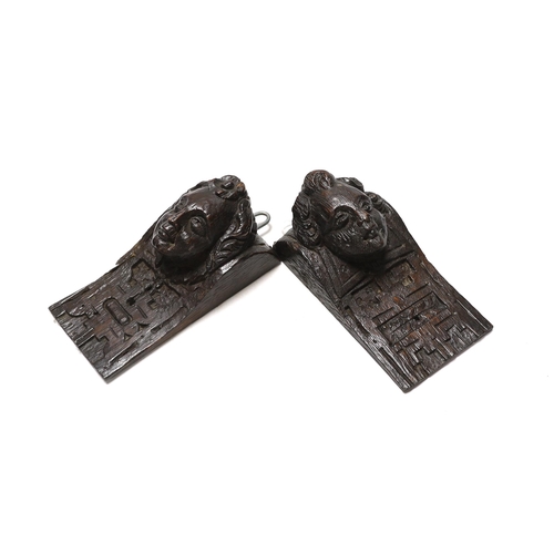 312 - Three 17th century carved oak figural corbels together with corbel end in the form of a lion, larges... 