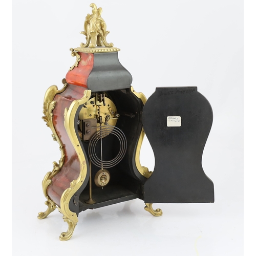 313 - An early 20th century French ormolu mounted red tortoiseshell eight day mantel clock, of Louis XVI s... 