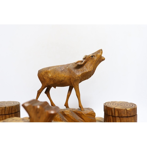 316 - A Swiss carved wood desk set surmounted with a deer, 41cm wide