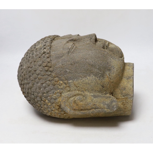 327 - A reconstituted stone model of Buddhas head, 25cm