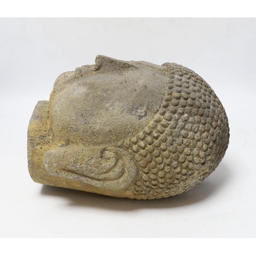 327 - A reconstituted stone model of Buddhas head, 25cm