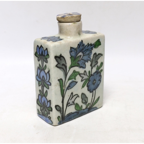 352 - An Iznik tin-glazed pottery flask and cover, 15cm