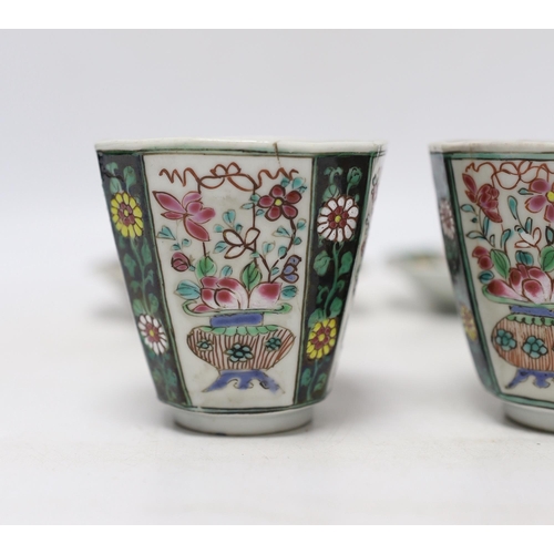 354 - A pair of Chinese Qianlong famille rose octagonal cups and saucers, with panelled floral decoration,... 