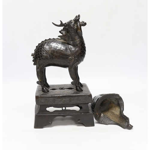 358 - An 18th century Chinese bronze figure of a qilin together with a Japanese figural bronze mount, tall... 