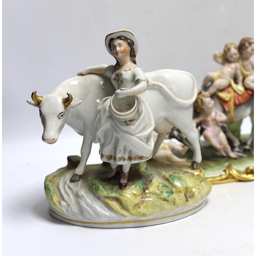 362 - A pair of 19th century Staffordshire cow groups and an Italian donkey and cherub group, tallest 20.5... 