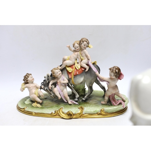 362 - A pair of 19th century Staffordshire cow groups and an Italian donkey and cherub group, tallest 20.5... 