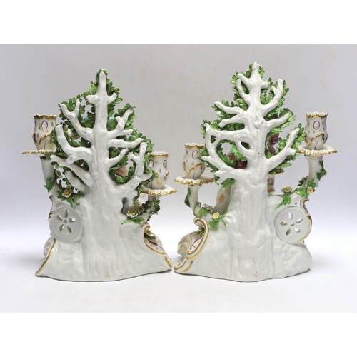 364 - A pair of late 19th century Samson figural porcelain candle holders, 26cm