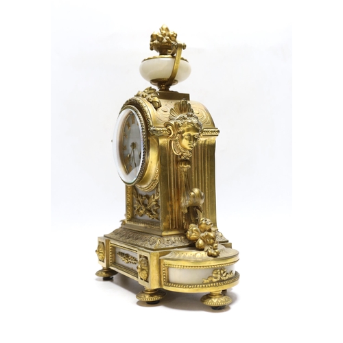 365 - A late 19th century French gilt metal and onyx mantel clock, 34cm