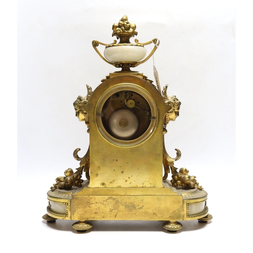 365 - A late 19th century French gilt metal and onyx mantel clock, 34cm