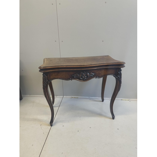 37 - A Victorian burr walnut serpentine folding card table, width 84cm, depth 42cm, height 73cm