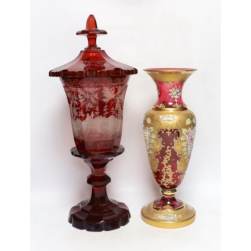 383 - A late 19th century Bohemian ruby flashed and wheel engraved glass vase and cover, 52cm high and a V... 