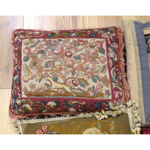 389 - A late 18th century Flemish verdure tapestry fragment made into a cushion, a similar burgundy silk v... 