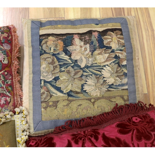 389 - A late 18th century Flemish verdure tapestry fragment made into a cushion, a similar burgundy silk v... 