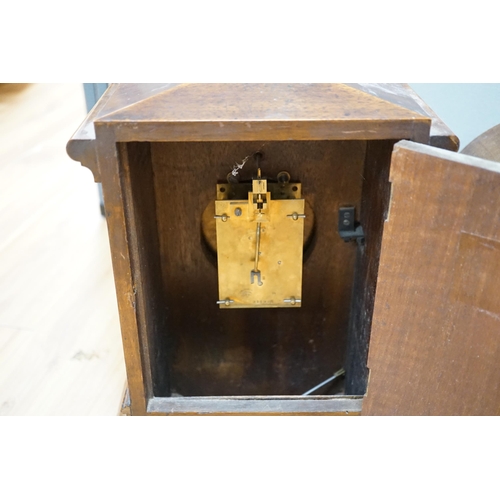 391 - Two early 20th century mantel clocks; a mahogany timepiece and an inlaid Edwardian clock with engine... 