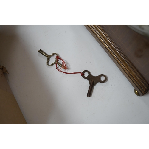 391 - Two early 20th century mantel clocks; a mahogany timepiece and an inlaid Edwardian clock with engine... 