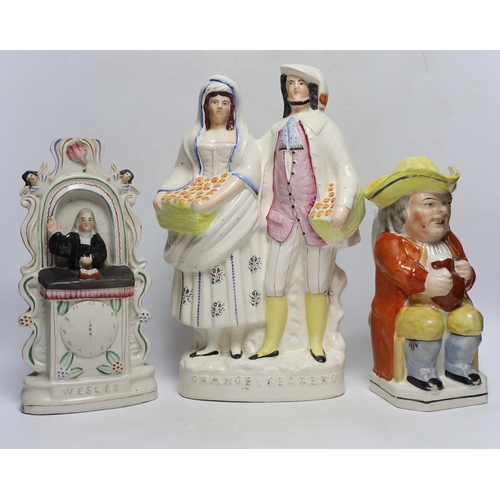 394 - Seven 19th century Staffordshire figure groups including Orange Sellers and Wesley, together with a ... 