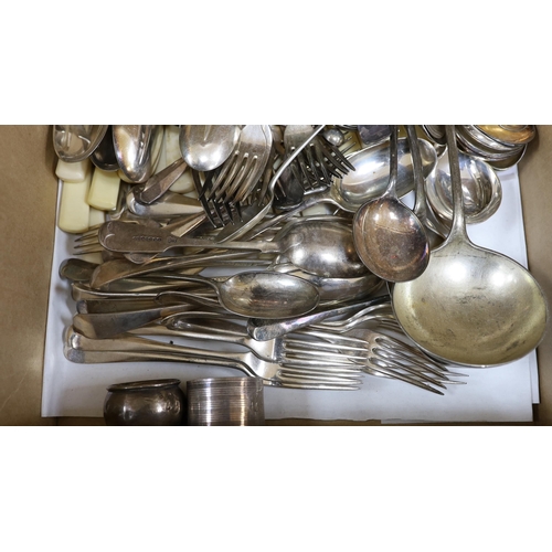 413 - Three silver napkin rings, three silver spoons and a quantity of silver plated cutlery.