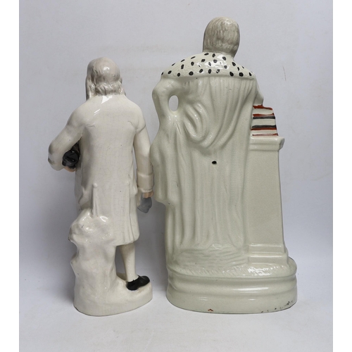 415 - A Staffordshire pottery figure of Benjamin Franklin, modelled holding the Bill of Rights and a Staff... 