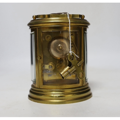 425 - A late 19th century French oval brass cased eight day carriage clock