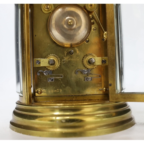 425 - A late 19th century French oval brass cased eight day carriage clock