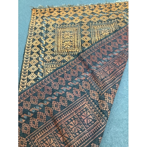 43 - An Afghan geometric rug, 205cm x 138cm