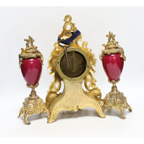 432 - An early 20th century French gilt metal clock garniture, 30cm