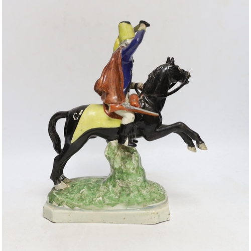 435 - A Staffordshire pearlware group of a Hussar on a leaping horse, c.1820, restored, 27cm high